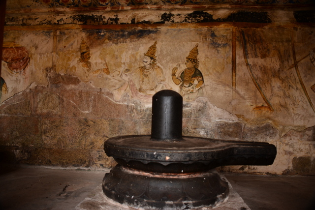 Chola paintings in a dilapidated condition with the lingam in the front. 