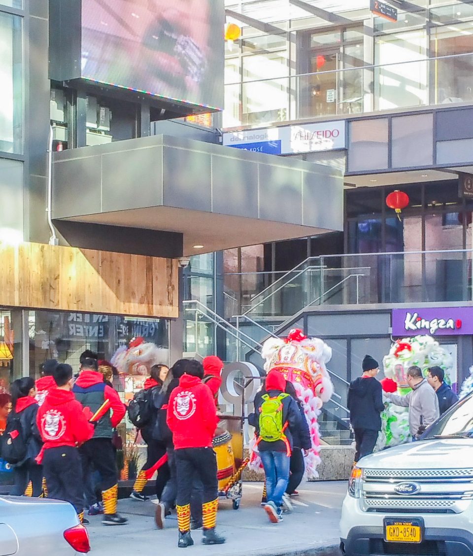 Lion Dancers performing in the street at Chinatown, Flushing, NYC