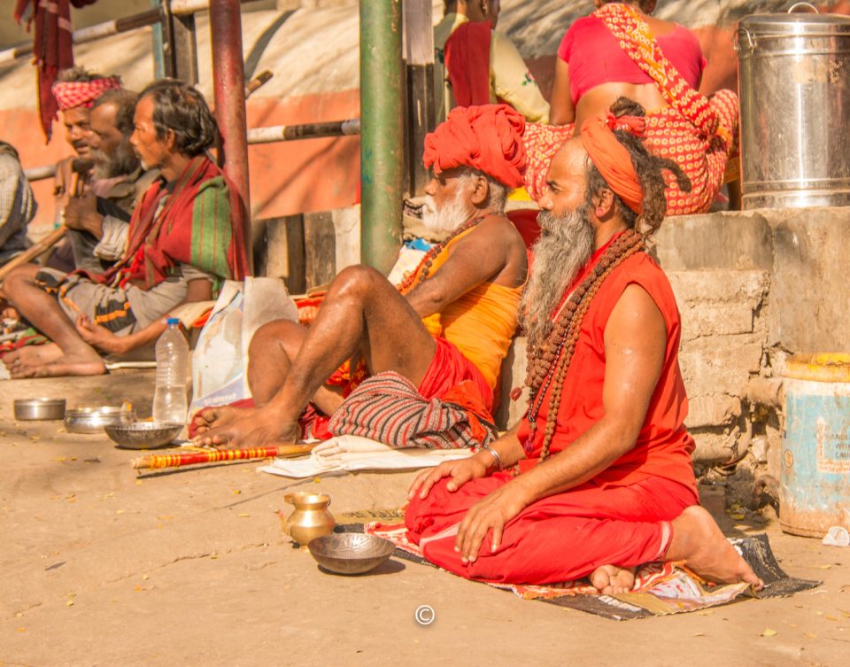 Swamis begging for alms outside the temple