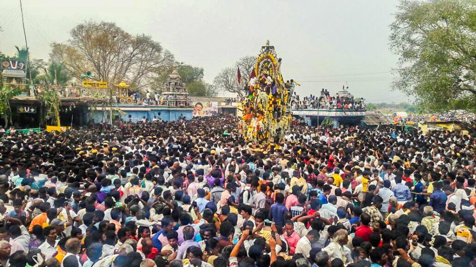 Aravan being paraded in a chariot amidst dancing and music in the village of Koovagam